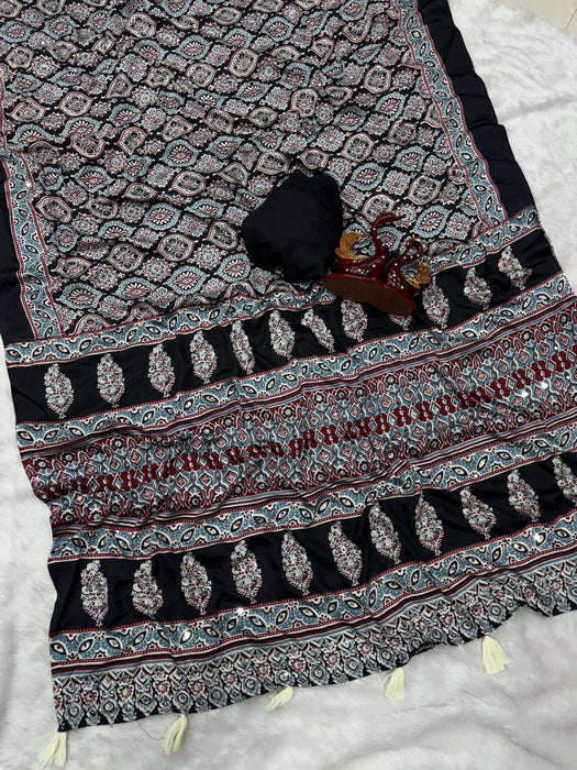 Soft crepe silk with Beautiful Ajarakh print with Real mirror work and beautiful tussle Saree